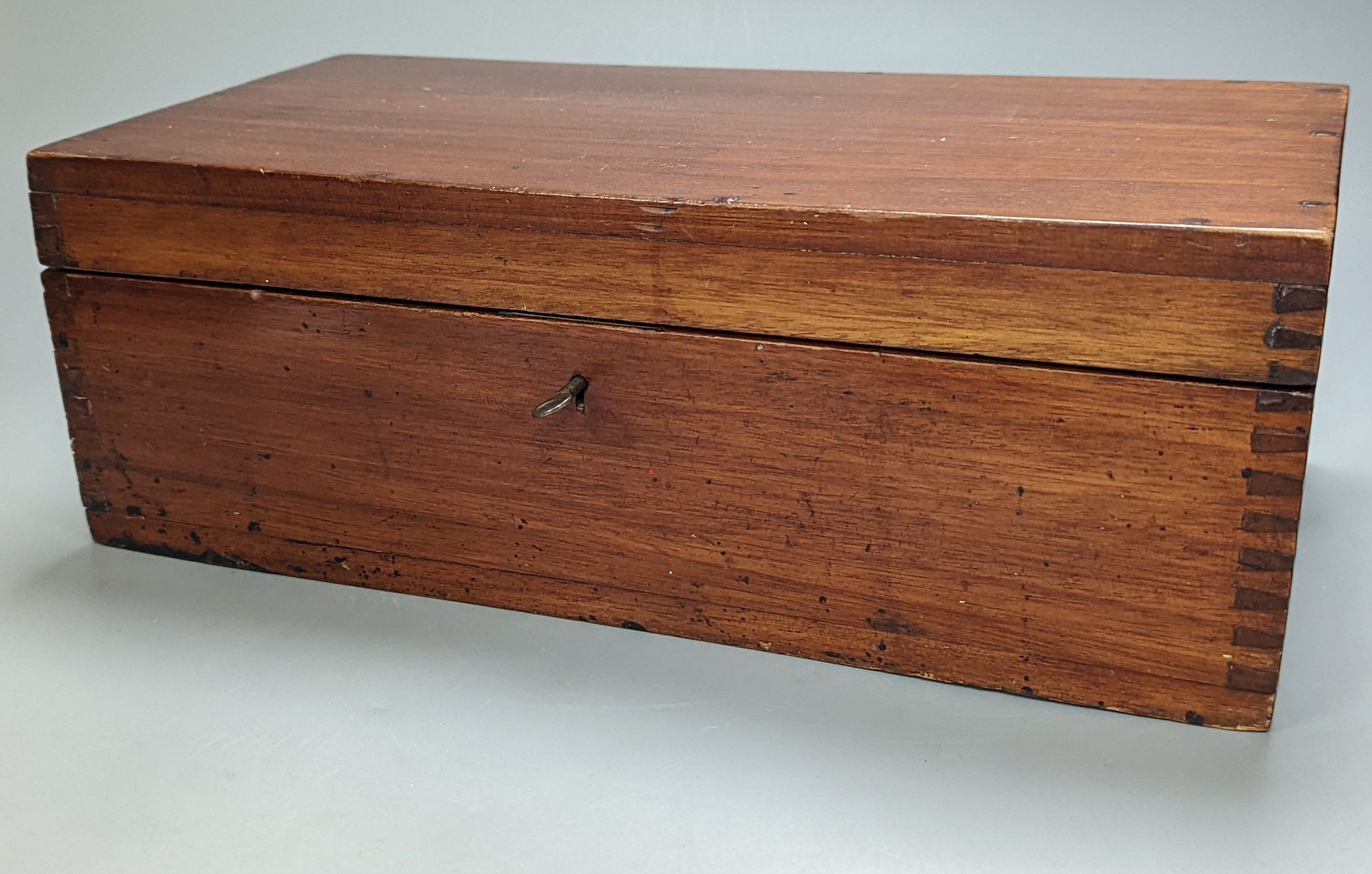 An early 20th century large mahogany case of electrum drawing instruments, wood squares and rulers, 37 x 18.5cm, incomplete